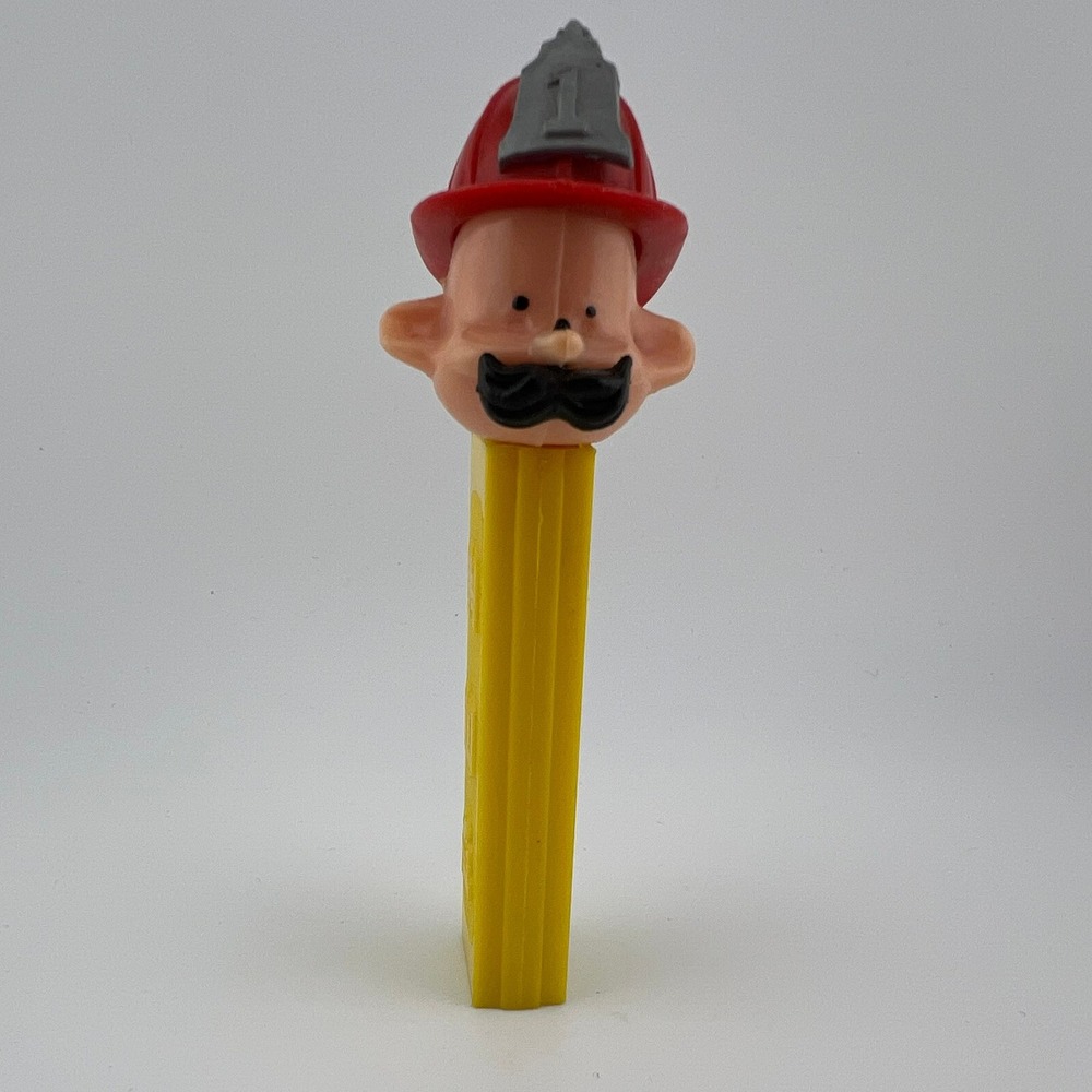 Vintage PEZ Fireman Dispenser Yellow Stem Hong Kong Collectible 3.4